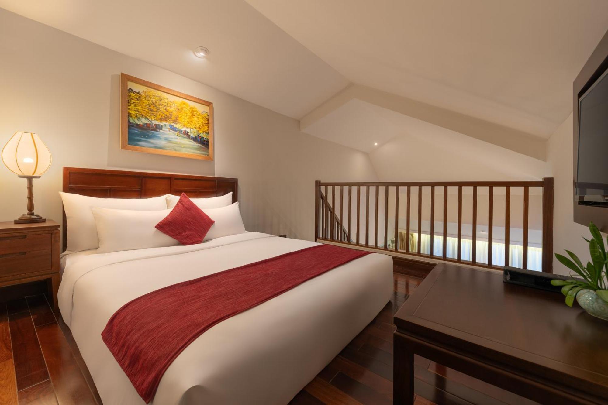 Rivertown Hoi An Resort & Spa Kültér fotó A bedroom at the hotel